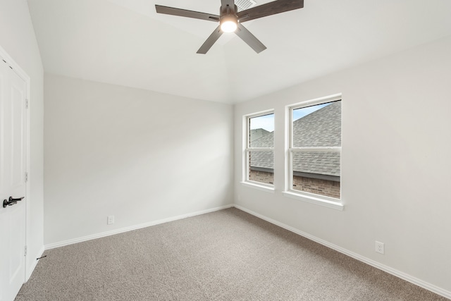 spare room featuring carpet flooring and ceiling fan