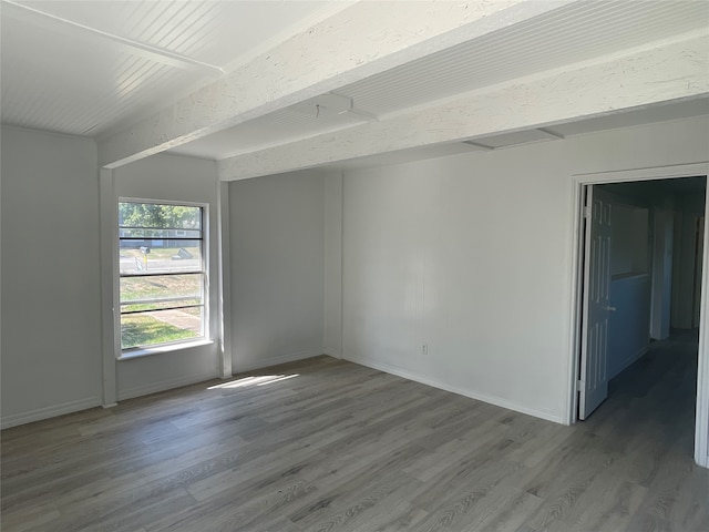 empty room featuring wood-type flooring