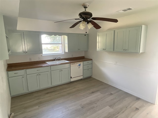 kitchen featuring ceiling fan, white dishwasher, sink, light wood-type flooring, and wood counters