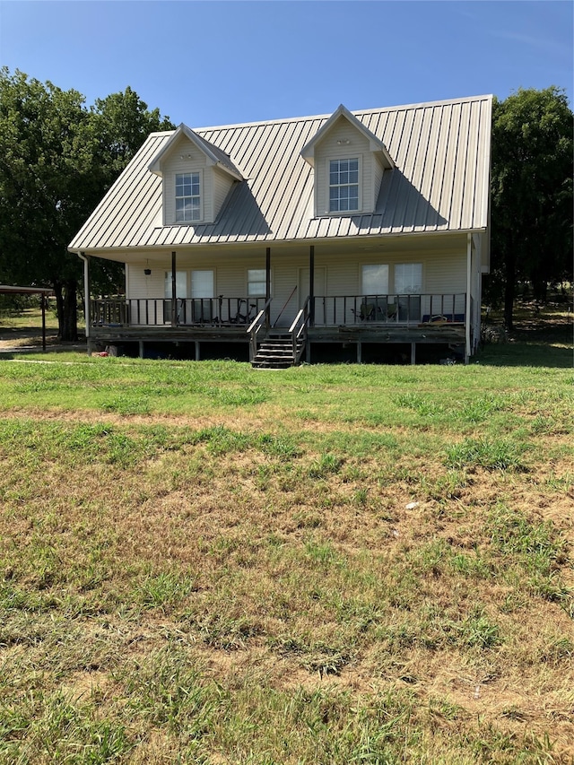 view of front of house with a porch and a front yard