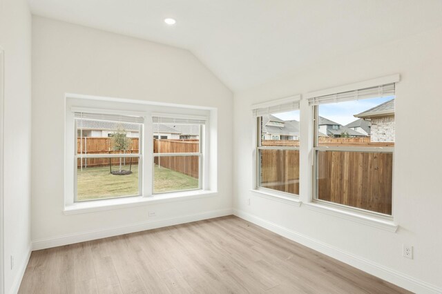 unfurnished sunroom with lofted ceiling