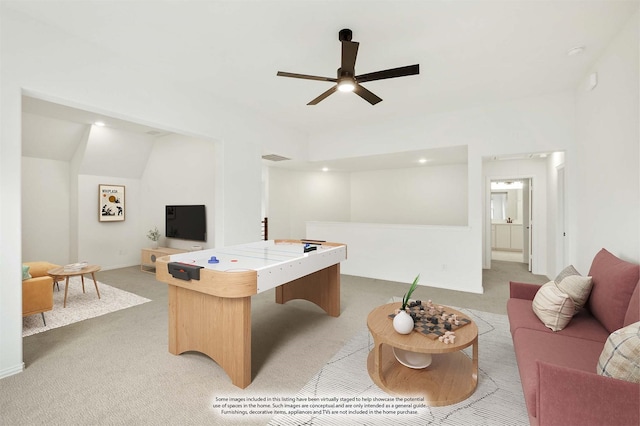 rec room with ceiling fan and light colored carpet