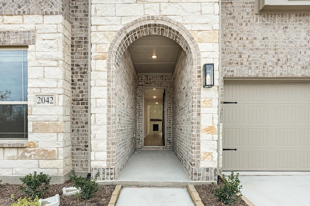 entrance to property featuring a garage