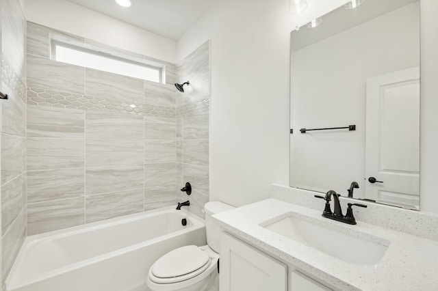 full bathroom with vanity, toilet, and tiled shower / bath