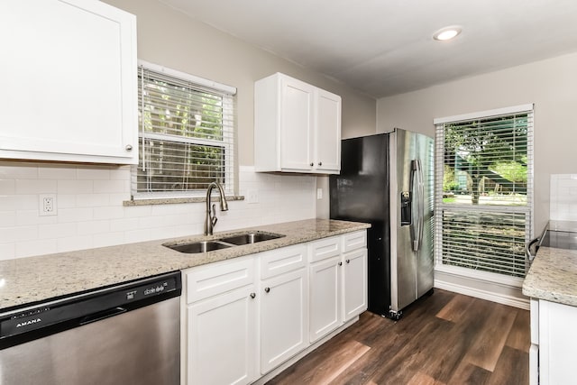 kitchen featuring white cabinetry, appliances with stainless steel finishes, dark hardwood / wood-style floors, sink, and tasteful backsplash