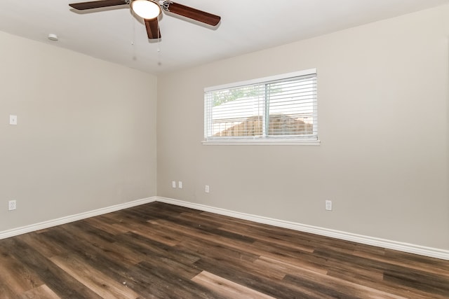 empty room with ceiling fan and dark hardwood / wood-style floors