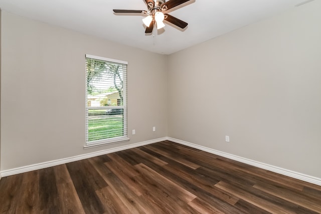 spare room with dark hardwood / wood-style floors and ceiling fan