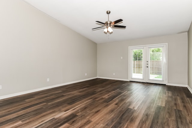 spare room with dark hardwood / wood-style floors, ceiling fan, french doors, and vaulted ceiling