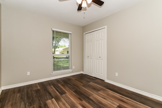 interior space with dark hardwood / wood-style flooring and ceiling fan