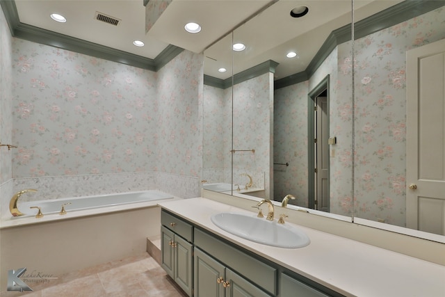 bathroom featuring a tub, vanity, ornamental molding, and tile patterned flooring