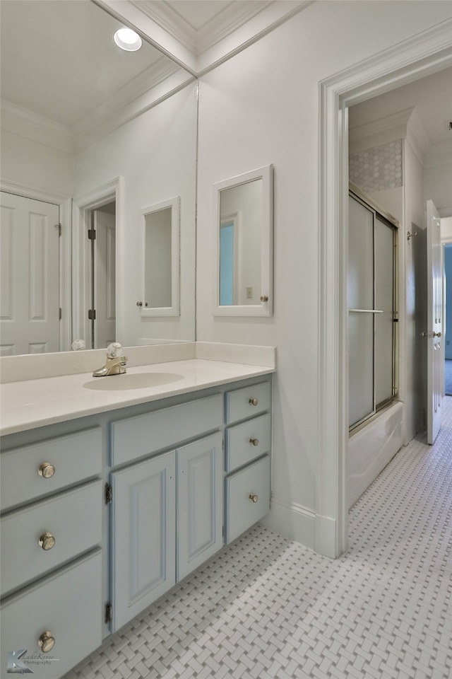 bathroom featuring crown molding, vanity, and tile patterned floors