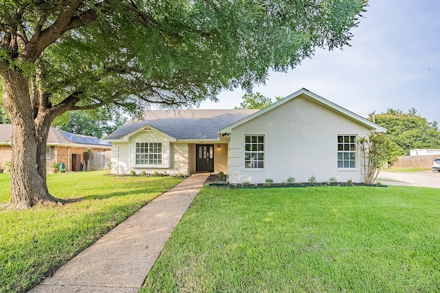 single story home with a front lawn