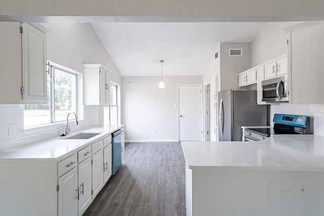 kitchen with white cabinetry, hanging light fixtures, stainless steel appliances, and sink