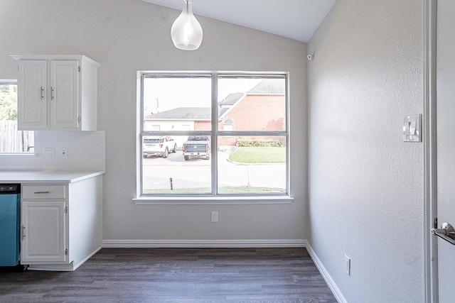 kitchen featuring white cabinets, tasteful backsplash, dishwasher, and lofted ceiling