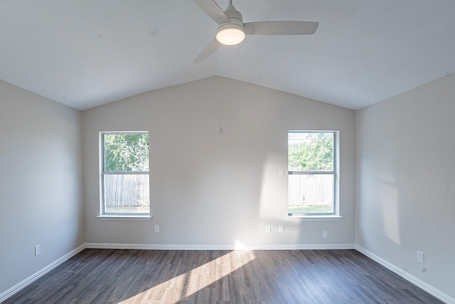 empty room featuring ceiling fan, dark hardwood / wood-style floors, and lofted ceiling