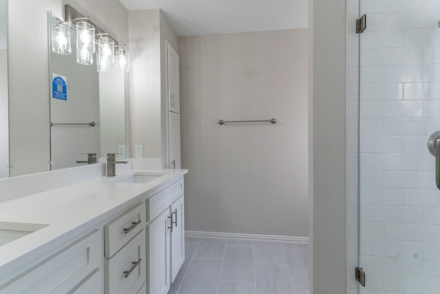 bathroom featuring tile patterned flooring, vanity, and an enclosed shower