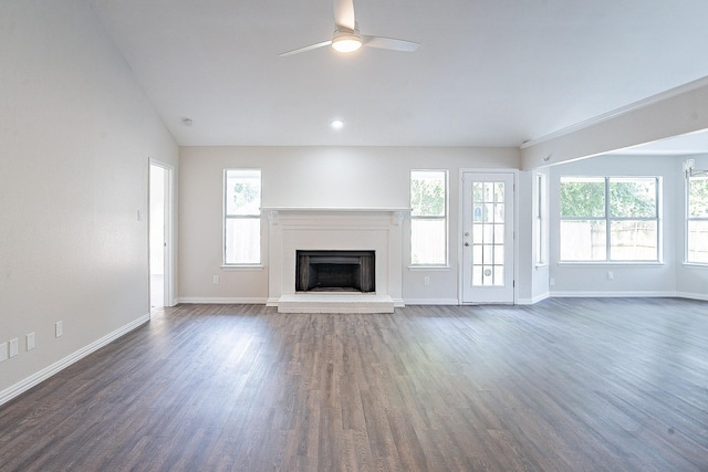 unfurnished living room featuring a fireplace, vaulted ceiling, ceiling fan, and dark wood-type flooring