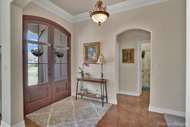 foyer with french doors and ornamental molding