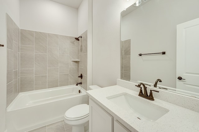 full bathroom with toilet, vanity, tiled shower / bath, and tile patterned floors