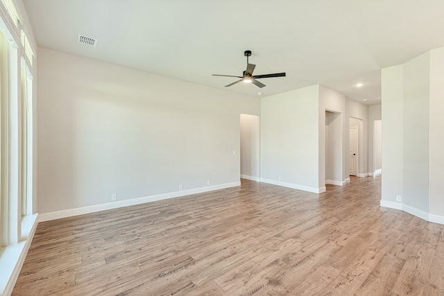 spare room featuring ceiling fan and light wood-type flooring