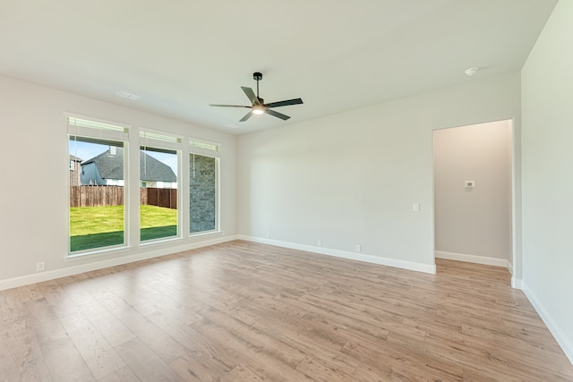 unfurnished room featuring light wood-type flooring and ceiling fan