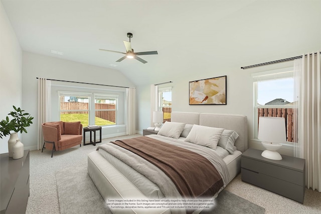 bedroom featuring vaulted ceiling, ceiling fan, and light colored carpet