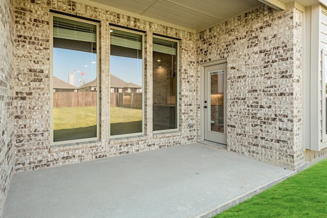 property entrance featuring a patio