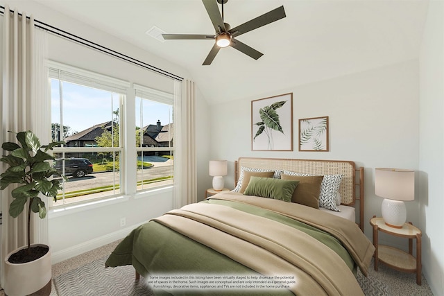 carpeted bedroom featuring ceiling fan and vaulted ceiling