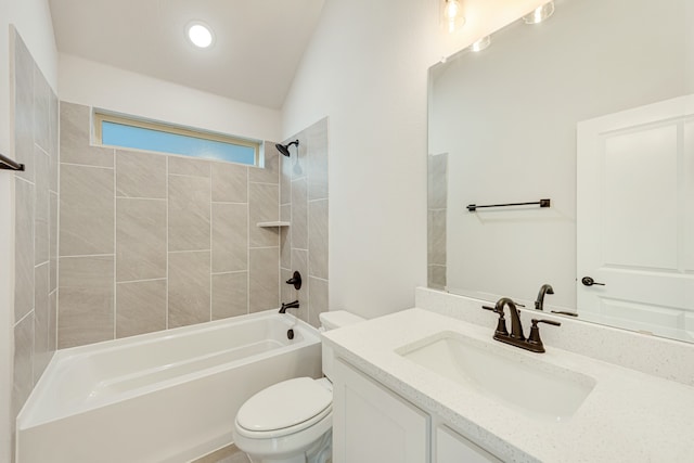 full bathroom with toilet, tiled shower / bath, and vanity