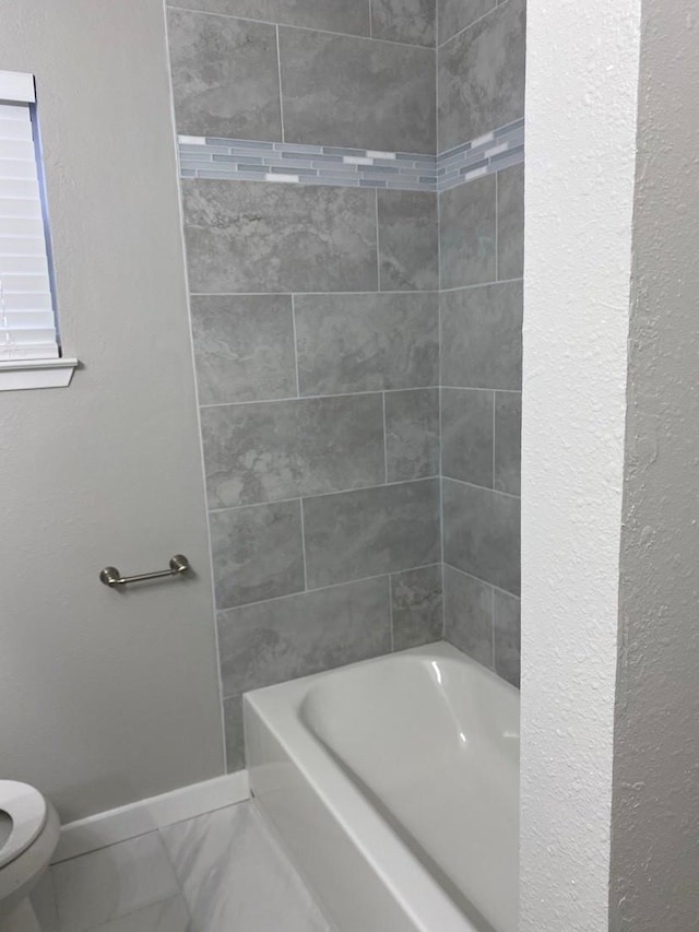 bathroom with toilet and tile floors