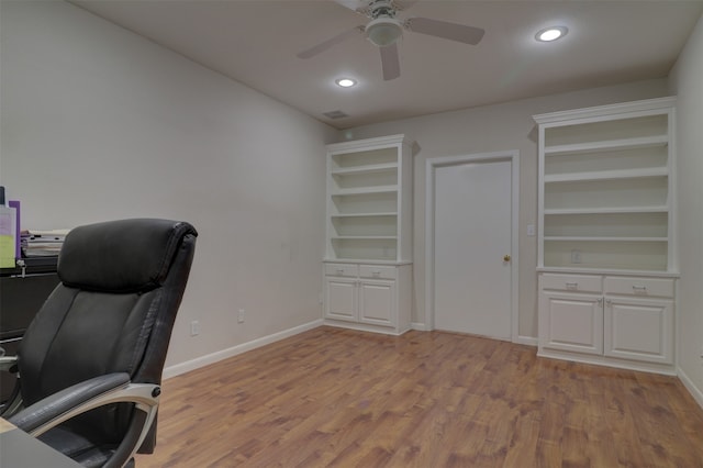 office area featuring light hardwood / wood-style floors and ceiling fan