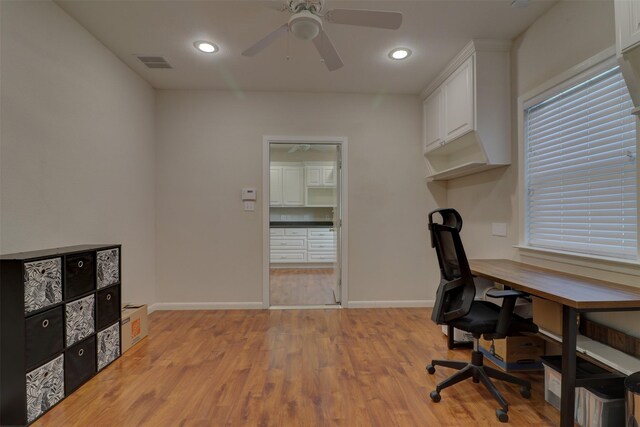 office area with ceiling fan and light hardwood / wood-style flooring