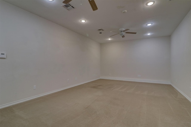 spare room featuring light carpet, baseboards, visible vents, a ceiling fan, and recessed lighting