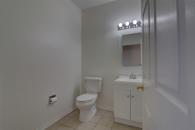 bathroom featuring tile patterned flooring, vanity, and toilet