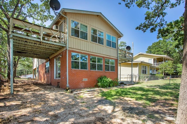 back of house featuring a deck