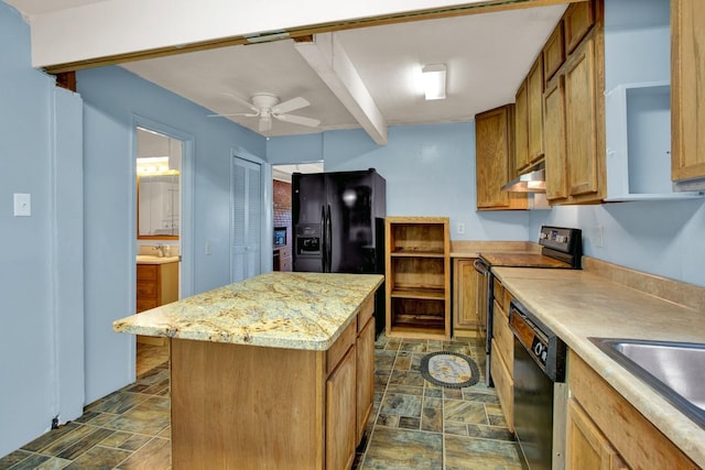 kitchen featuring sink, a kitchen island, ceiling fan, and black appliances