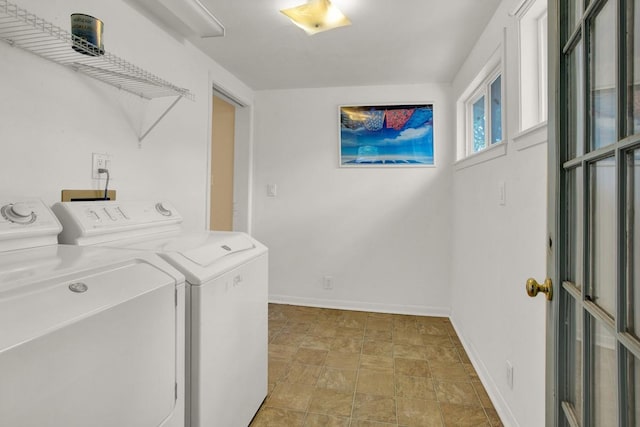 clothes washing area featuring washer and clothes dryer