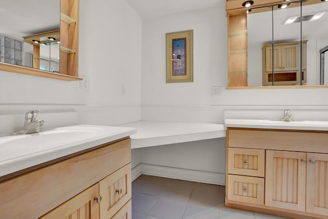 bathroom featuring tile patterned flooring and vanity