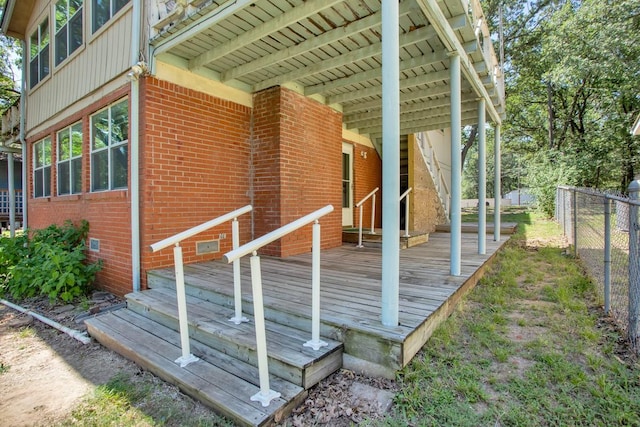 view of side of home featuring a wooden deck