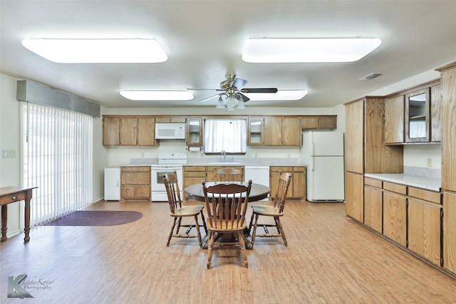 kitchen with ceiling fan, light hardwood / wood-style floors, white appliances, and sink