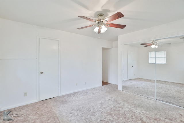 unfurnished room featuring ceiling fan and carpet floors