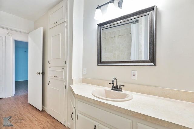 bathroom featuring vanity and wood-type flooring