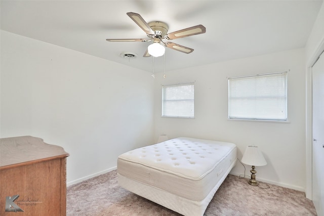 bedroom featuring ceiling fan and light colored carpet