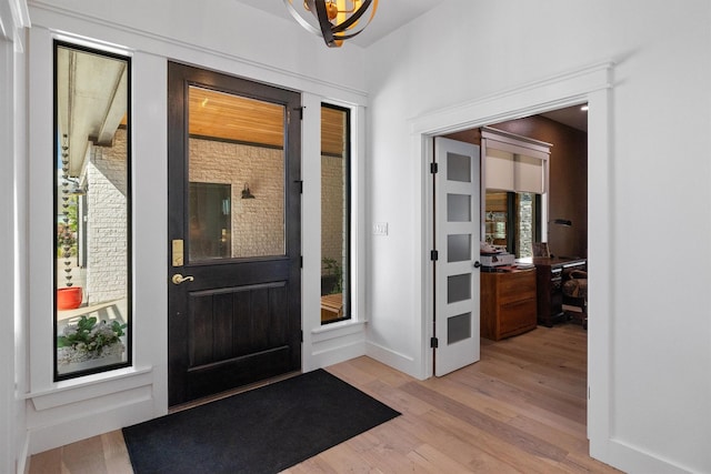 foyer entrance with light hardwood / wood-style flooring