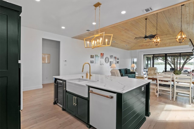 kitchen with decorative light fixtures, sink, beverage cooler, a center island with sink, and wooden ceiling