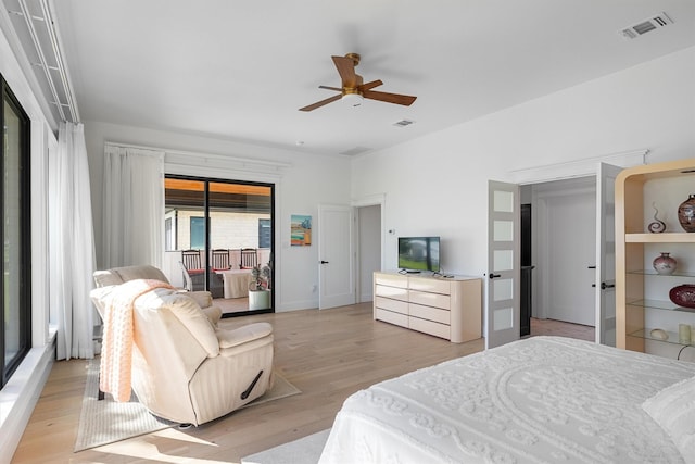 bedroom featuring light wood-type flooring, access to outside, and ceiling fan