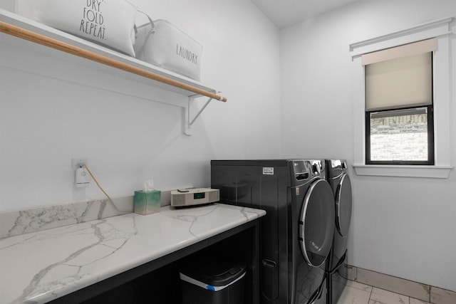 laundry room featuring separate washer and dryer