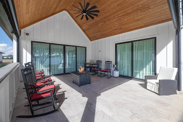 view of patio / terrace with ceiling fan and an outdoor fire pit