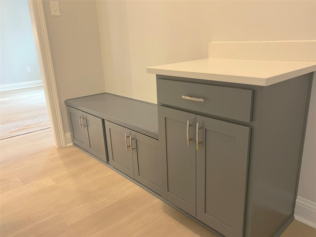 details featuring baseboards and wood finished floors