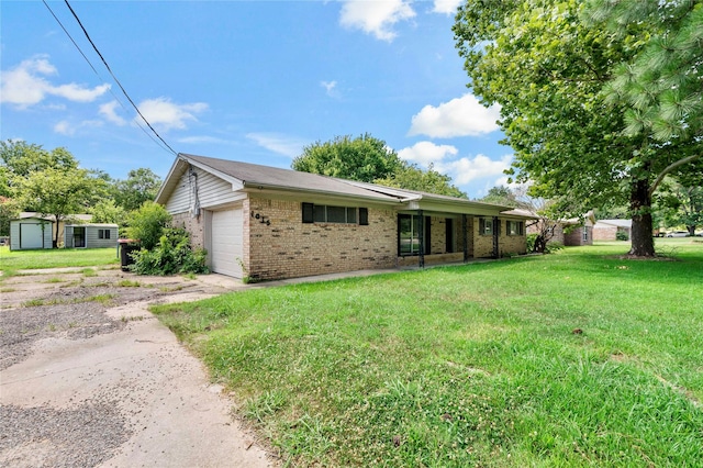 ranch-style home featuring a garage and a front lawn